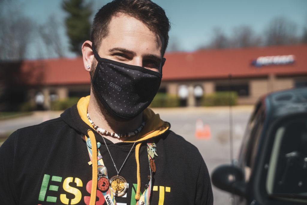 Budtender Arod with Mask standing outside of Remedy
