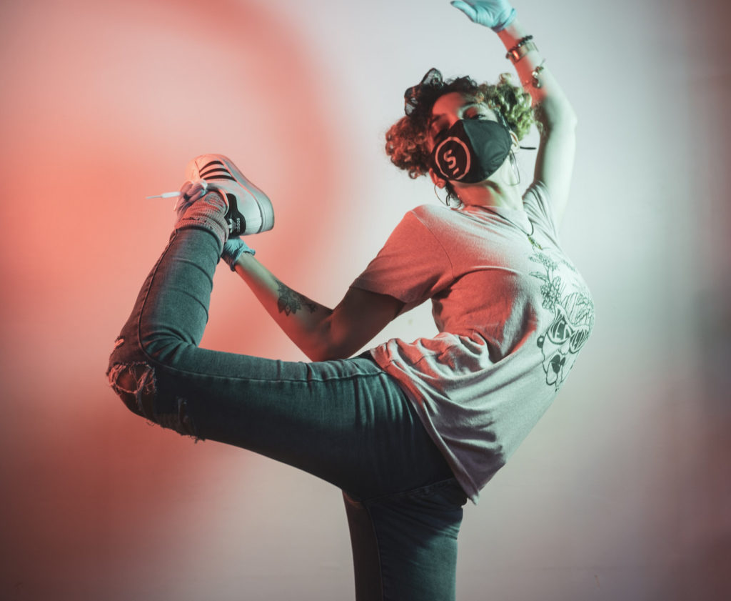 Budtender Dana Dance Pose inside Remedy Dispensary